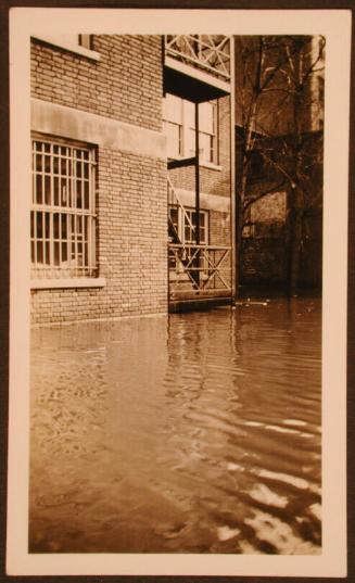 Closeup of Flood Waters Near Building and Stairs