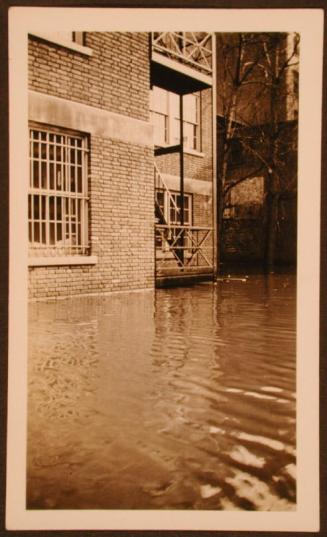 Closeup of Flood Waters Near Building and Stairs