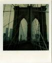 Brooklyn Bridge, with Manhattan buildings in the background, including World Trade Center tower ...