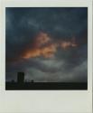 Pink and gray clouds (sunrise/sunset) over silhouette of roof, Gift of the Richard Welling Fami ...
