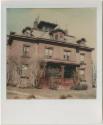 Second Empire building with multiple roof lines, dormers and a cupola.  Gift of the Richard Wel ...