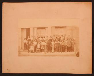 Group of Men, Including A. Hatch, in Front of Goodyear Shop