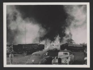 Hartford Circus Fire: Burning tent behind circus wagons