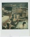 View of Main Street, with the construction of One Corporate Center in background.  Gift of the …