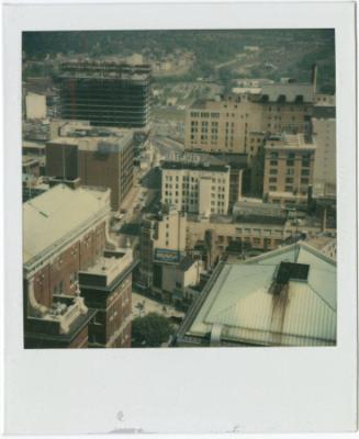 View of Main Street, with the construction of One Corporate Center in background.  Gift of the …