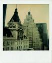 Paramount Building with globe and clock on top, with old New York Times building in foreground,…