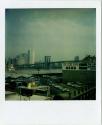 Brooklyn Bridge, with Brooklyn warehouses in foreground, Manhattan in background, Gift of the R…