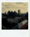 New Haven with Yale University buildings in foreground, Phelps Hall in midground, Gold Building…
