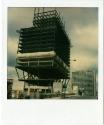 Construction of One Corporate Center (Stilt Building), with Sheraton Hotel in the background, G…