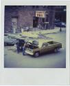 Car and truck next to Union Station, probably Union Place, Hartford, Gift of the Richard Wellin…