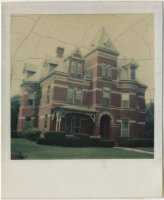 Queen Anne / Romanesque Revival house with multiple peaked roofs and dormers.  Gift of the Rich…