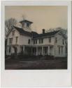 Two-story Italianate house with cupola and covered porch.  Gift of the Richard Welling Family, …