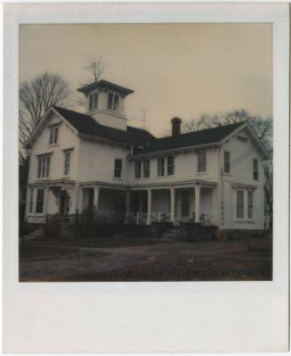 Two-story Italianate house with cupola and covered porch.  Gift of the Richard Welling Family, …
