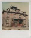 Second Empire building with multiple roof lines, dormers and a cupola.  Gift of the Richard Wel…