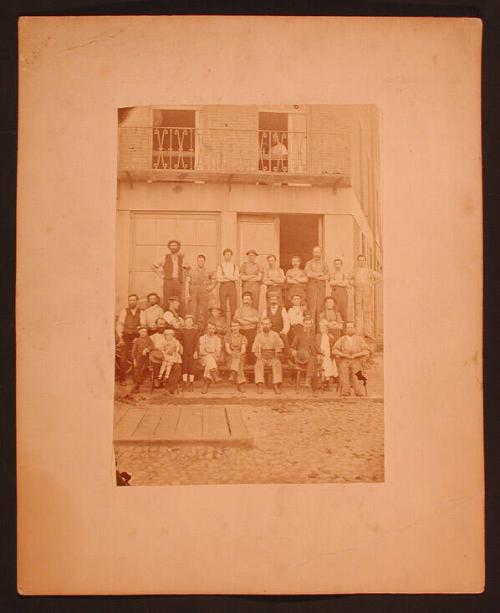 Group of Men in Front of Goodyear Shop