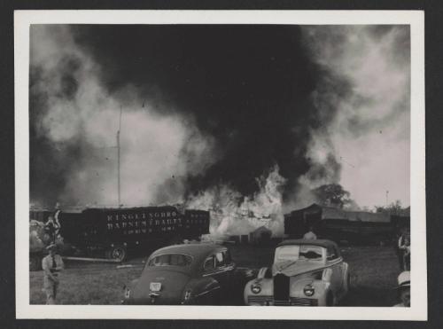 Hartford Circus Fire: Burning tent behind circus wagons