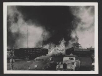 Hartford Circus Fire: Burning tent behind circus wagons