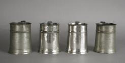 Frontal view of 1974.56.2.1-.3 and a fourth mug from the communion set, privately owned.