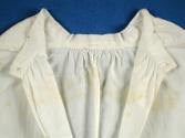 Inside of neckline.