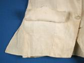 Faux pocket flap lifted, revealing no pocket.