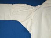 Front of proper right sleeve.