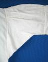 Back of proper right sleeve.