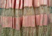 Detail of fabric on skirt.

Gift of Mrs. Seth P. Holcombe and Mrs. Gilbert A. Wicke, 1981.26.…