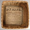 Newspaper advertisement lining the interior of the basket.